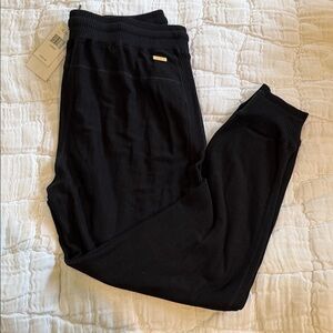 Alala Black Jogger with Gold Logo Plaque